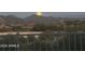 Night view featuring mountains and a full moon as seen beyond the railing at 9620 E Roadrunner Dr, Scottsdale, AZ 85262