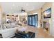 Open-concept living area featuring a kitchen, dining area, and living room with a fireplace and neutral decor at 9620 E Roadrunner Dr, Scottsdale, AZ 85262