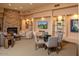 Inviting lounge area with stone fireplace, comfortable seating, and stylish decor perfect for relaxing and entertaining at 9620 E Roadrunner Dr, Scottsdale, AZ 85262