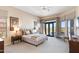 Serene primary bedroom with desert views, neutral colors, and luxurious furnishings at 9620 E Roadrunner Dr, Scottsdale, AZ 85262
