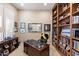 Inviting office with custom built-ins, ample natural light, and sophisticated decor at 9620 E Roadrunner Dr, Scottsdale, AZ 85262