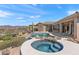 Inviting outdoor living space with a pool, spa, and landscaped backyard at 9620 E Roadrunner Dr, Scottsdale, AZ 85262
