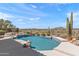 Backyard pool oasis with a stunning desert landscape and relaxing water feature at 9620 E Roadrunner Dr, Scottsdale, AZ 85262