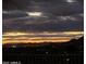 Dusk settling over the golf course with a sunset sky providing a stunning backdrop to the desert landscape at 9620 E Roadrunner Dr, Scottsdale, AZ 85262