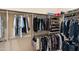 Walk-in closet with ample shelving, hanging racks, and space for shoe storage, keeping everything organized at 9620 E Roadrunner Dr, Scottsdale, AZ 85262