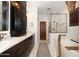 Luxurious bathroom featuring a soaking tub, walk-in shower, and dual vanity at 9858 E South Bend Dr, Scottsdale, AZ 85255