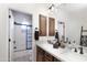 Bathroom features a double sink vanity and walk-in shower with stylish fixtures at 9858 E South Bend Dr, Scottsdale, AZ 85255