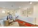 Second-floor landing featuring a cozy chaise lounge and natural light at 9858 E South Bend Dr, Scottsdale, AZ 85255