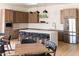 Modern kitchen features stainless steel appliances, light wood cabinets, and a spacious center island with counter seating at 9858 E South Bend Dr, Scottsdale, AZ 85255