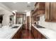 Gourmet kitchen with custom cabinets, stainless appliances, granite countertops, and hardwood floors at 9858 E South Bend Dr, Scottsdale, AZ 85255