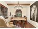 Bright home office with wood floors, natural light, an area rug, and a decorative chandelier at 9858 E South Bend Dr, Scottsdale, AZ 85255