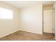 Bedroom with carpet flooring, natural light, and neutral walls perfect for relaxation and personalization at 1055 W Dragoon Ave, Mesa, AZ 85210
