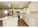 Updated kitchen featuring modern cabinets, stainless appliances, and quartz countertops at 1055 W Dragoon Ave, Mesa, AZ 85210
