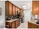 Well-equipped kitchen with granite countertops, stainless steel appliances, and ample cabinet space at 10855 W Buccaneer Dr, Sun City, AZ 85351