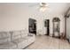 Comfortable living room with a view of the dining room and access to other areas at 10855 W Buccaneer Dr, Sun City, AZ 85351