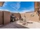 Outdoor patio featuring a stone floor, outdoor seating, a BBQ grill, and a brick wall at 10855 W Buccaneer Dr, Sun City, AZ 85351