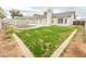 Backyard with grass, block wall, a fence, and a small in-ground pool at 1366 E Desert Fern Trl, Casa Grande, AZ 85122