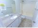 This bathroom features a shower-tub and single sink with granite countertop at 1366 E Desert Fern Trl, Casa Grande, AZ 85122