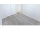 Bedroom with neutral carpet, white walls and sliding door closet at 1366 E Desert Fern Trl, Casa Grande, AZ 85122