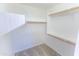 Walk-in closet with multiple levels of shelving at 1366 E Desert Fern Trl, Casa Grande, AZ 85122