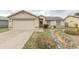 Charming single-story home with a two-car garage and low-maintenance desert landscaping at 1366 E Desert Fern Trl, Casa Grande, AZ 85122