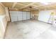 This garage is spacious and has a clean, unfinished interior with a ladder at 1366 E Desert Fern Trl, Casa Grande, AZ 85122