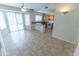 Bright kitchen with tile flooring, a kitchen island, white appliances, and wood cabinetry at 1366 E Desert Fern Trl, Casa Grande, AZ 85122