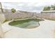 Private in-ground pool with rock waterfall feature in enclosed backyard at 1366 E Desert Fern Trl, Casa Grande, AZ 85122