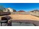 Large dirt backyard with a grill and a purple car toy at 1472 E Avenida Kino --, Casa Grande, AZ 85122