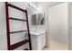 Bright bathroom featuring a single sink vanity and an adjacent open shelving unit at 1472 E Avenida Kino --, Casa Grande, AZ 85122