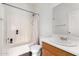 Functional bathroom with a combination tub-shower and a wooden vanity sink at 1472 E Avenida Kino --, Casa Grande, AZ 85122