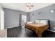 Comfortable bedroom offering natural light, modern decor, and dark hardwood flooring at 1472 E Avenida Kino --, Casa Grande, AZ 85122