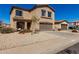 Charming two-story home with a two-car garage, covered entry, and desert landscaping at 1472 E Avenida Kino --, Casa Grande, AZ 85122
