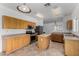 Spacious kitchen showcasing wood cabinets, stainless steel appliances, and a functional island at 1472 E Avenida Kino --, Casa Grande, AZ 85122