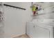 Efficient laundry room equipped with a washer, dryer, and shelving for organized storage at 1472 E Avenida Kino --, Casa Grande, AZ 85122