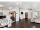 Bright, open living room featuring hardwood floors, natural light, and a modern kitchen view at 1472 E Avenida Kino --, Casa Grande, AZ 85122