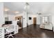Bright, open living room featuring hardwood floors, natural light, and a modern kitchen view at 1472 E Avenida Kino --, Casa Grande, AZ 85122
