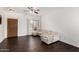 Inviting living room with hardwood floors, comfortable seating, a ceiling fan, and natural light at 1472 E Avenida Kino --, Casa Grande, AZ 85122