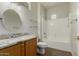 Bathroom featuring a single sink, granite countertop, and tiled shower-tub combo at 15136 W Cactus Ridge Way, Surprise, AZ 85374