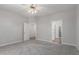 Spacious bedroom offers ample natural light and multiple doorways at 15136 W Cactus Ridge Way, Surprise, AZ 85374