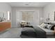 Tranquil bedroom with a bay window, neutral color scheme, and plush carpeting at 15136 W Cactus Ridge Way, Surprise, AZ 85374