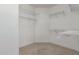 Spacious walk-in closet with multiple shelves for optimal organization and storage at 15136 W Cactus Ridge Way, Surprise, AZ 85374