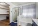 Bright bathroom features a glass shower stall, soaking tub, and custom vanity at 1701 E Countrywalk Ln, Chandler, AZ 85225