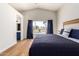 Bright bedroom features vaulted ceiling, wood floors, large window view of the pool at 1701 E Countrywalk Ln, Chandler, AZ 85225