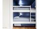 Bedroom with built-in bunkbeds and painted in a modern style at 1701 E Countrywalk Ln, Chandler, AZ 85225