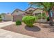 Charming home with a well-manicured front yard, mature landscaping, and a two-car garage at 1701 E Countrywalk Ln, Chandler, AZ 85225
