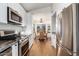 Bright kitchen featuring stainless steel appliances and views of the breakfast nook at 1701 E Countrywalk Ln, Chandler, AZ 85225