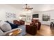 Bright living room with a large ceiling fan, recessed lighting, and a view of the backyard at 1701 E Countrywalk Ln, Chandler, AZ 85225