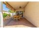 Covered patio with outdoor dining set and stamped concrete flooring at 1701 E Countrywalk Ln, Chandler, AZ 85225