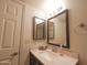 Bathroom featuring dual mirrors over a sink, complemented by neutral tones and classic fixtures for a clean aesthetic at 17620 N 17Th Pl # 36, Phoenix, AZ 85022